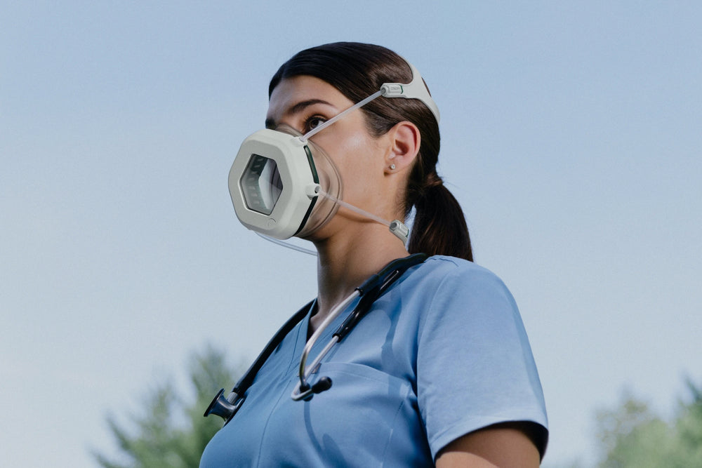 Woman donning Canopy respirator